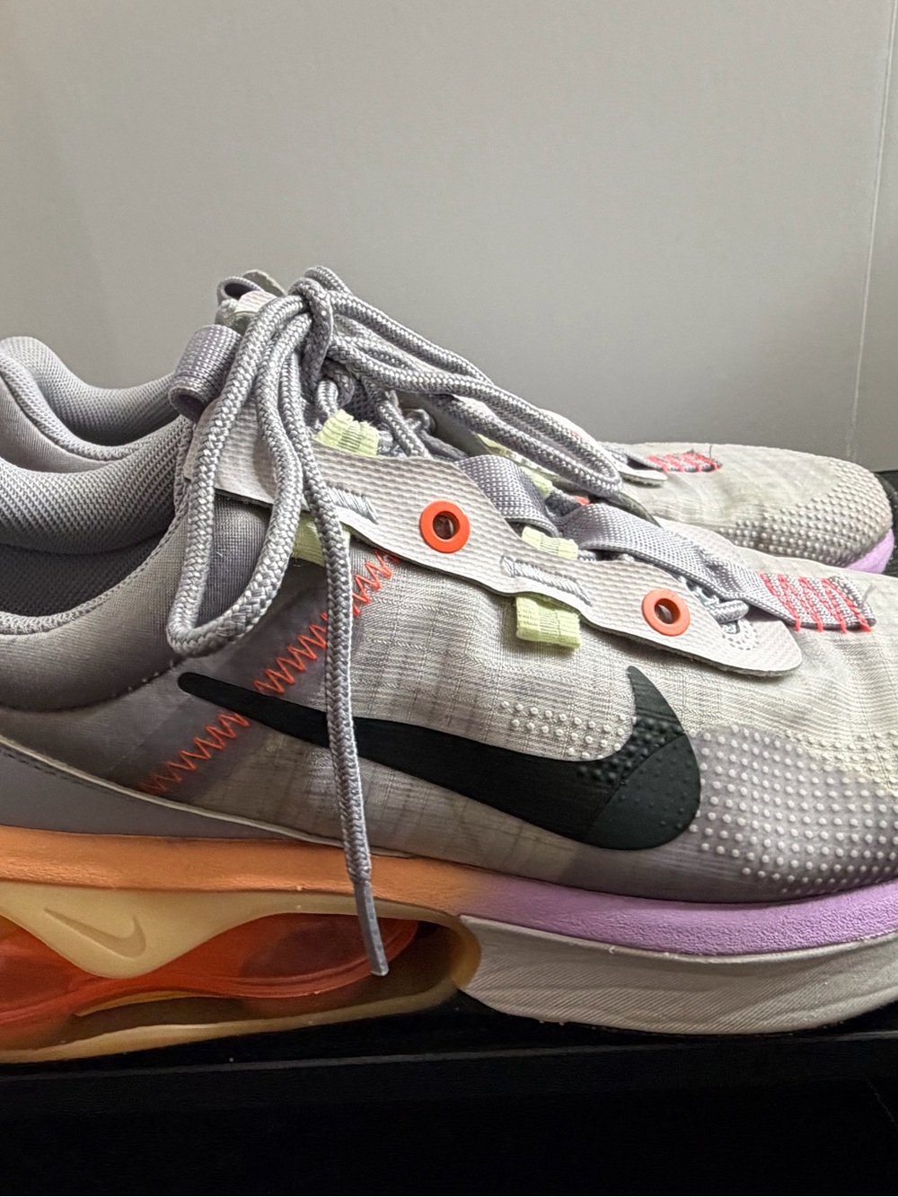 Nike Grey Athletic Sneakers with Black Swoosh and Orange Accents